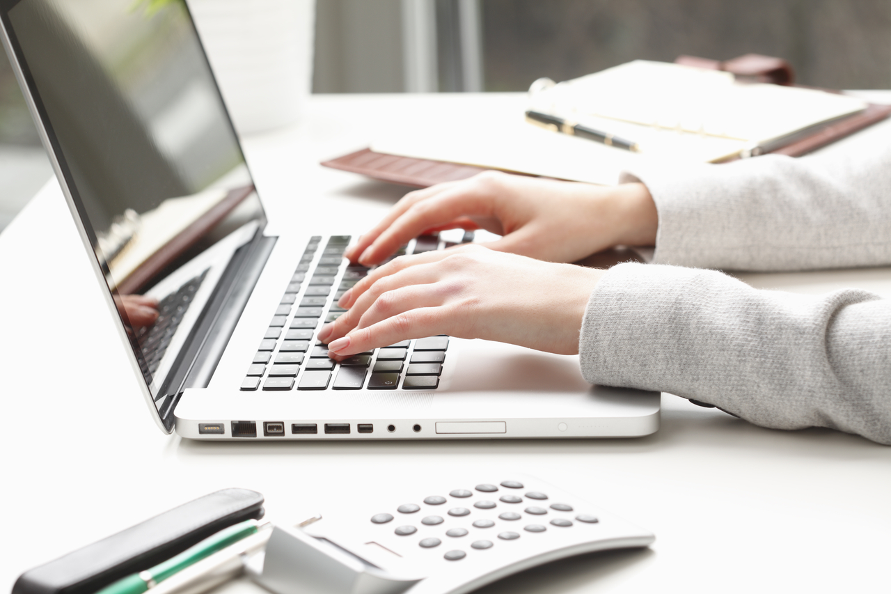 A person using a laptop at a desk (Getty Images Bank)