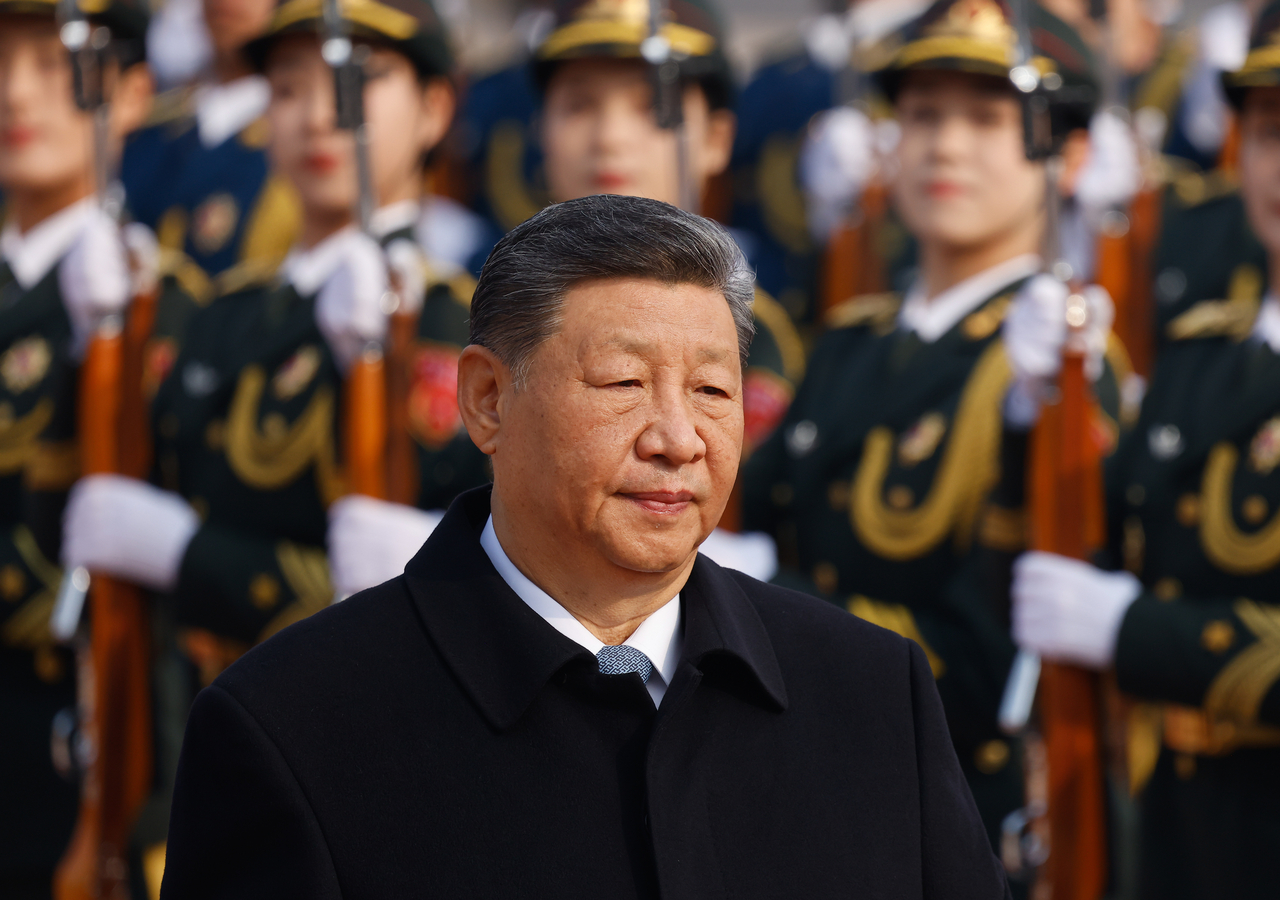 Chinese President Xi Jinping attends a welcoming ceremony for Spain's King Felipe VI and Queen Letizia at the Great Hall of the People in Beijing on Nov. 12 (Pool Photo via AP, File)