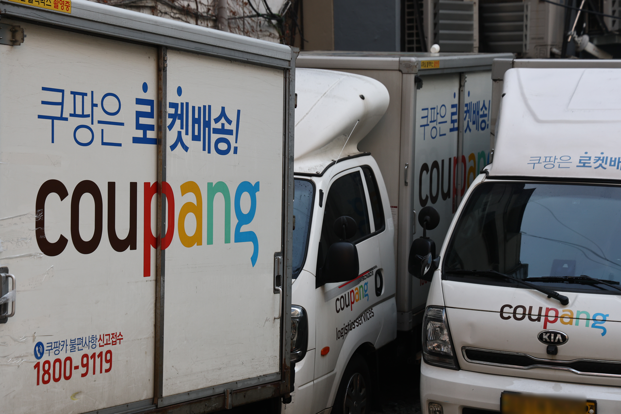 This photo shows Coupang delivery trucks on Saturday. (Yonhap)