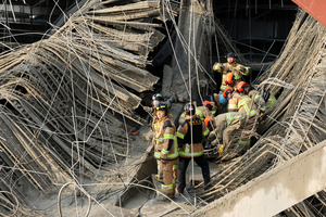 2 killed, 2 trapped after collapse at library construction site in