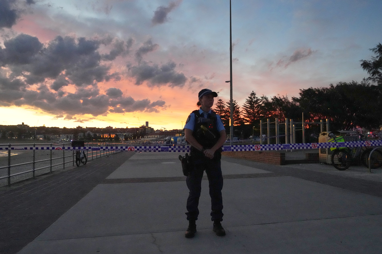 Police cordon off an area at Bondi Beach after a reported shooting in Sydney, Sunday. (AP-Yonhap)