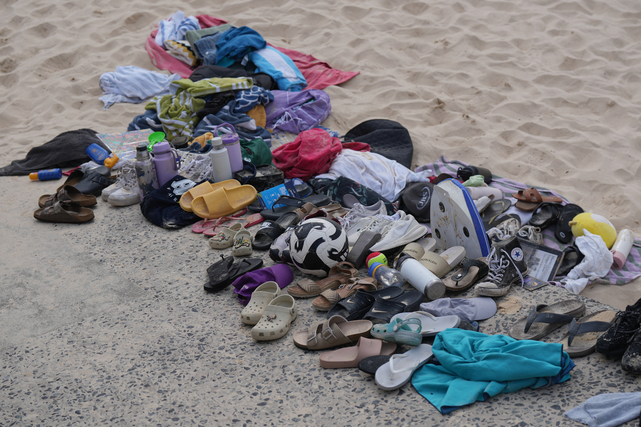 Belongings sit piled up after a shooting the day prior at Sydney's Bondi Beach, Monday. (AP-Yonhap)
