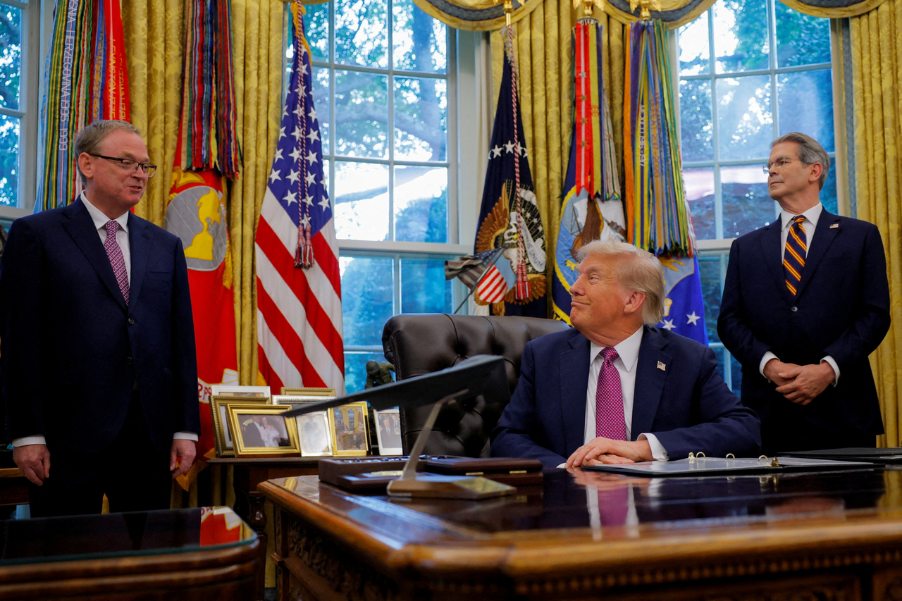 US President Donald Trump (center) and US Secretary of the Treasury Scott Bessent (right) listen as National Economic Council Director Kevin Hassett speaks, at the White House in Washington on Sept. 5.   Reuters-Yonhap