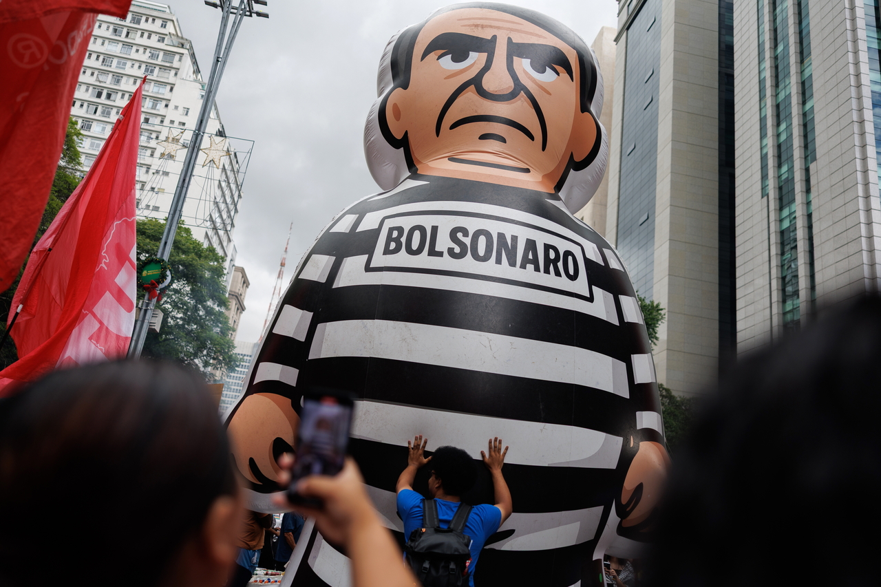 A figure depicting former Brazilian President Jair Bolsonaro is displayed during a demonstration in Sao Paulo, Sunday. (EPA-Yonhap)