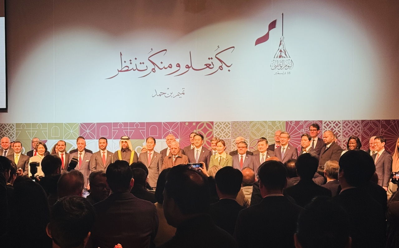 Members of the diplomatic corps in Seoul and distinguished guests pose for a group photo at the Qatar National Day event at Shilla Seoul in Jung-gu, Seoul, on Monday. (Sanjay Kumar/The Korea Herald)