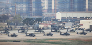 The US Senate has passed an annual defense policy bill that includes a measure to restrict the government from unilaterally reducing the current troop level of