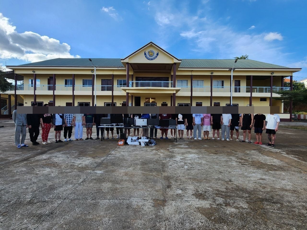 Cambodian police detain South Korean nationals during a joint raid with South Korean authorities at a scam compound in Mondulkiri province on Thursday. (Yonhap)