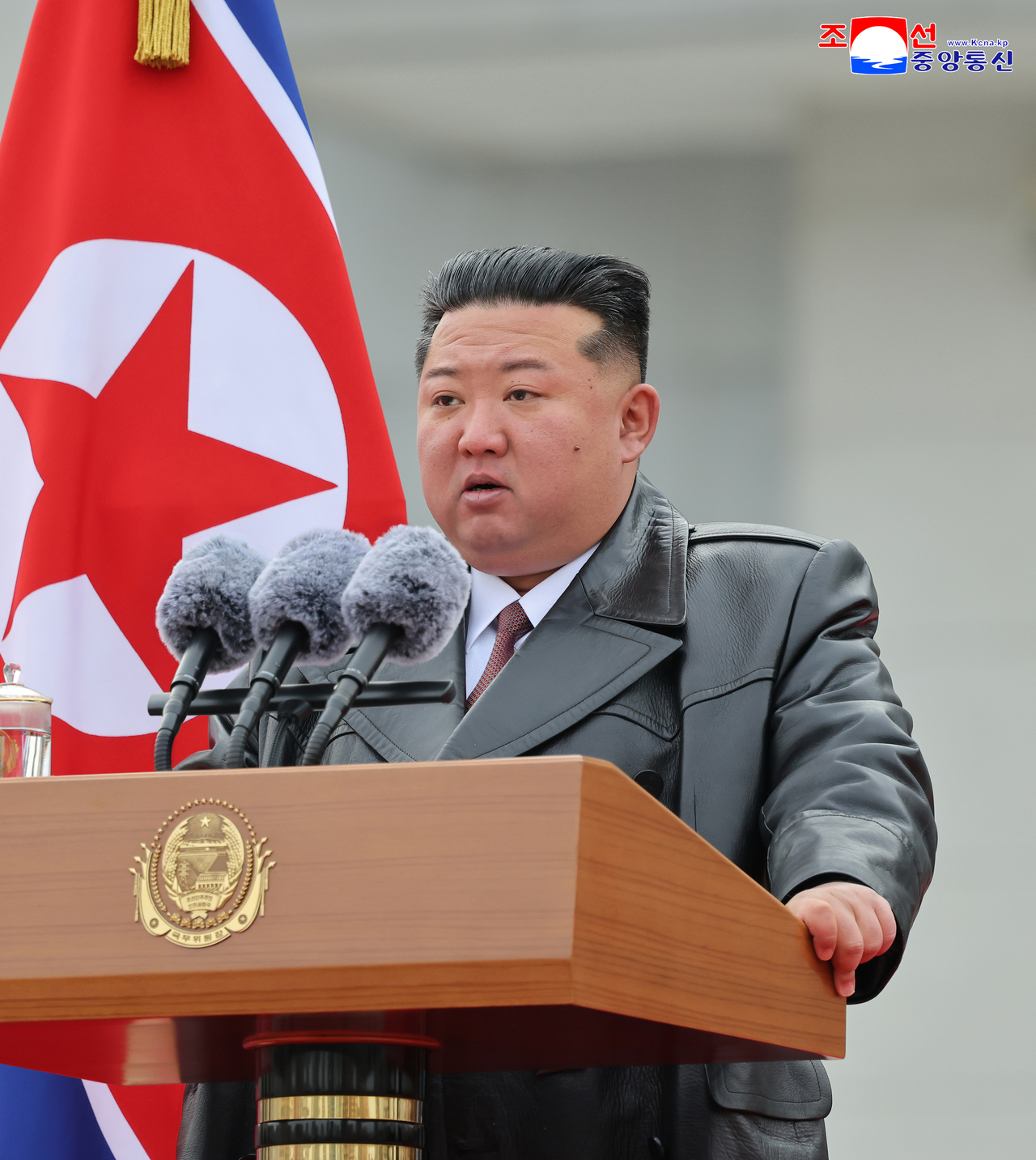 North Korean leader Kim Jong-un is seen making a speech at a ceremony welcoming the return of soldiers sent to support Russia in a photograph released by North Korean media on Dec. 13. (Yonhap)