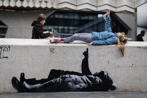 Banksy unveils new art in London following speculation over murals depicting stargazing figures