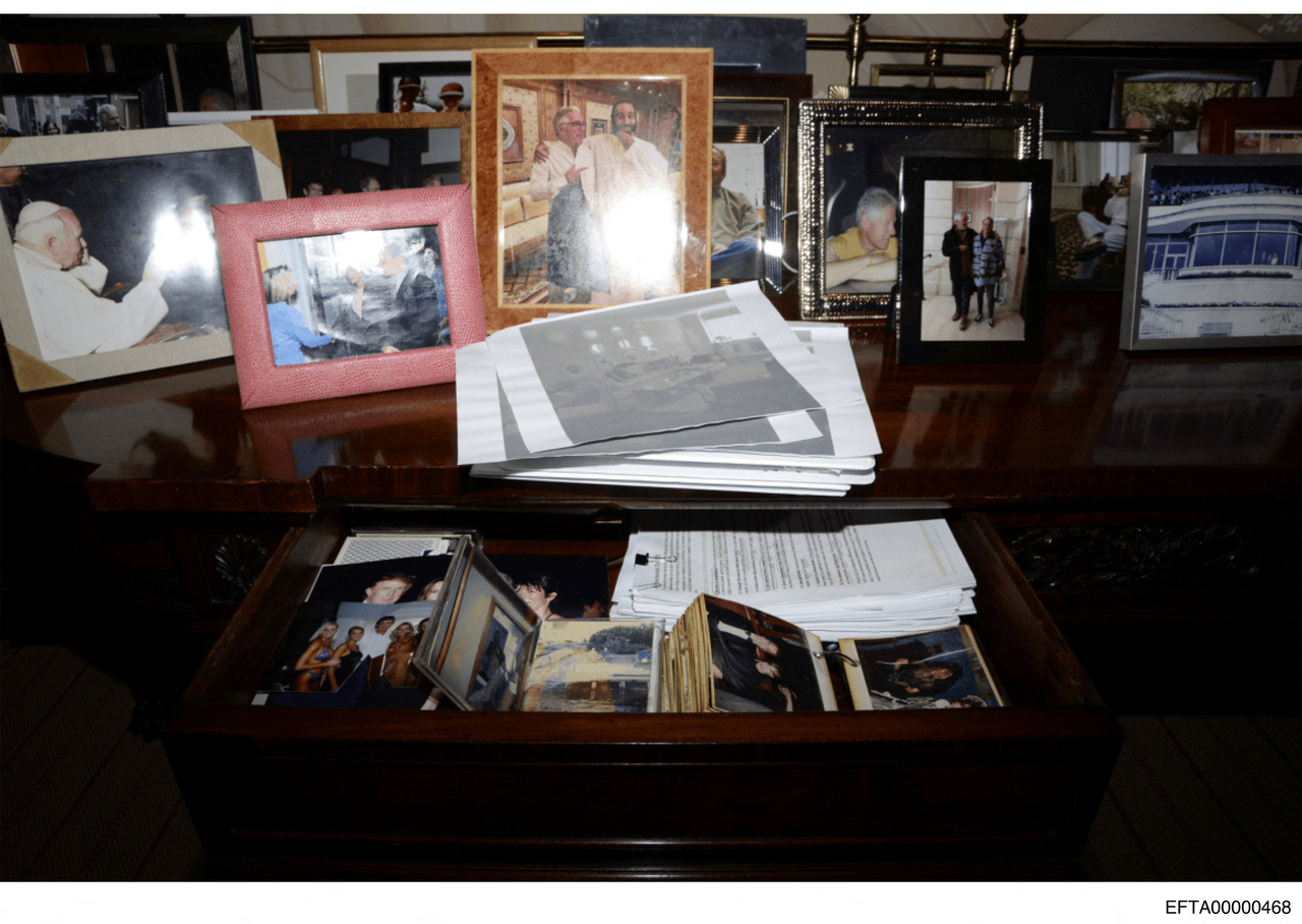 A view of drawers and framed photos, including of Donald Trump, in Jeffrey Epstein's Manhattan home is seen in this image released on Friday. (Reuters-Yonhap)