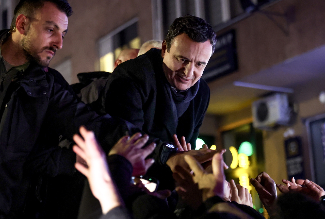 Acting Prime Minister of Kosovo and leader of Vetevendosje party Albin Kurti (top), greets supporters in Pristina, Kosovo, Sunday. (EPA-Yonhap)