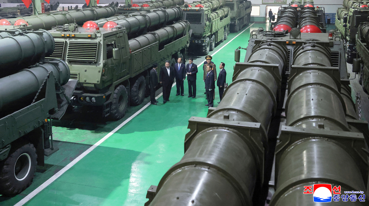 This photo shows columns of multiple rocket launchers produced at a munitions factory that the North's leader Kim Jong-un inspected on Sunday to review the production of weapons and combat equipment. (KCNA via Yonhap)