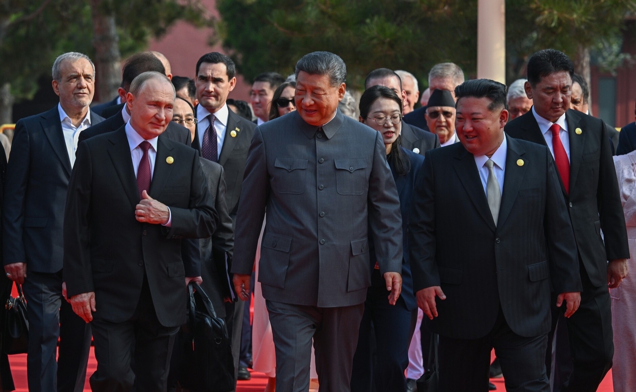 Russia's President Vladimir Putin (L) walks with China's President Xi Jinping (C) and North Korea's leader Kim Jong-un (R) meet in Beijing, Sept. 3. (Getty Images)