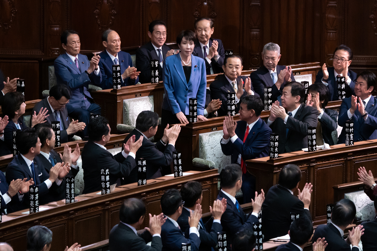 Japan's lawmakers applaud as Sanae Takaichi (center) is elected as Japan‘s new prime minister, in Tokyo, Oct. 21. (Getty Images)