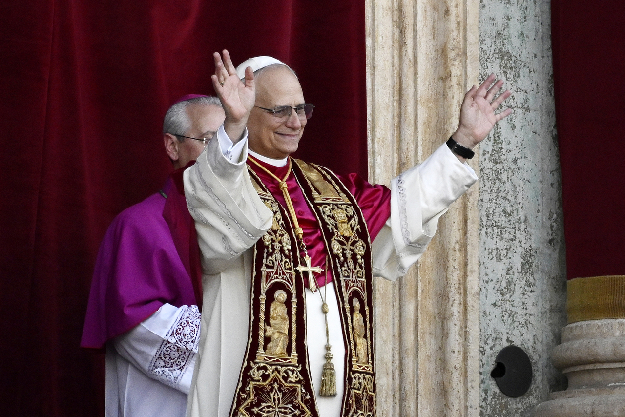 Newly elected Pope Leo XIV (center) blesses the faithful from the central loggia of St. Peter’s Basilica, in Vatican City, May 8. (Getty Images)