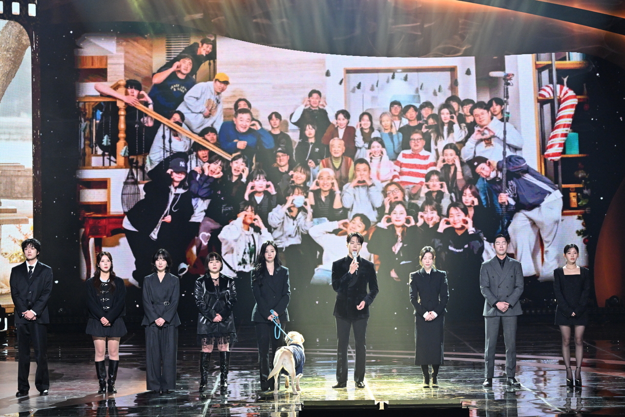 Musical actor Kai (sixth from left) and the cast members from Lee Soon-jae's final drama "Dog Knows Everything" take the stage during the KBS Drama Awards held Wednesday in Yeouido, Seoul. (Yonhap)