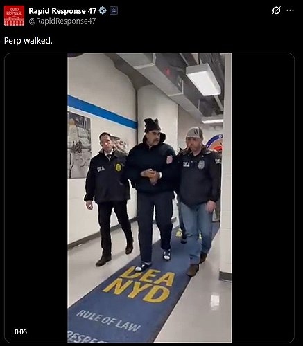 Venezuelan leader Nicolas Maduro (center) is escorted through a hallway inside the US Drug Enforcement Administration New York office building on Sunday. (White House Rapid Response's X account)