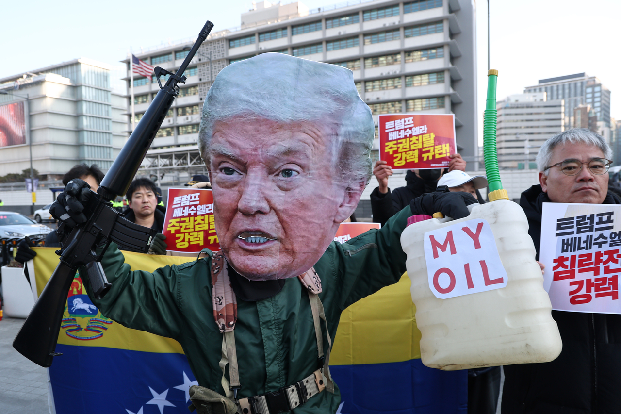Members of civic groups hold a press conference at Gwanghwamun Square in Seoul on Monday to denounce the United States for ousting Venezuelan President Nicolás Maduro through a military operation. (Yonhap)