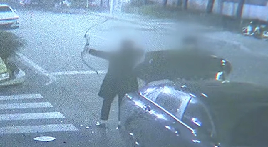 CCTV footage shows a suspect in his 20s firing an arrow from a vehicle parked near the Youth Plaza in Sangdang-gu, Cheongju, toward a woman walking her dog nearby, on Wednesday. (KBS)