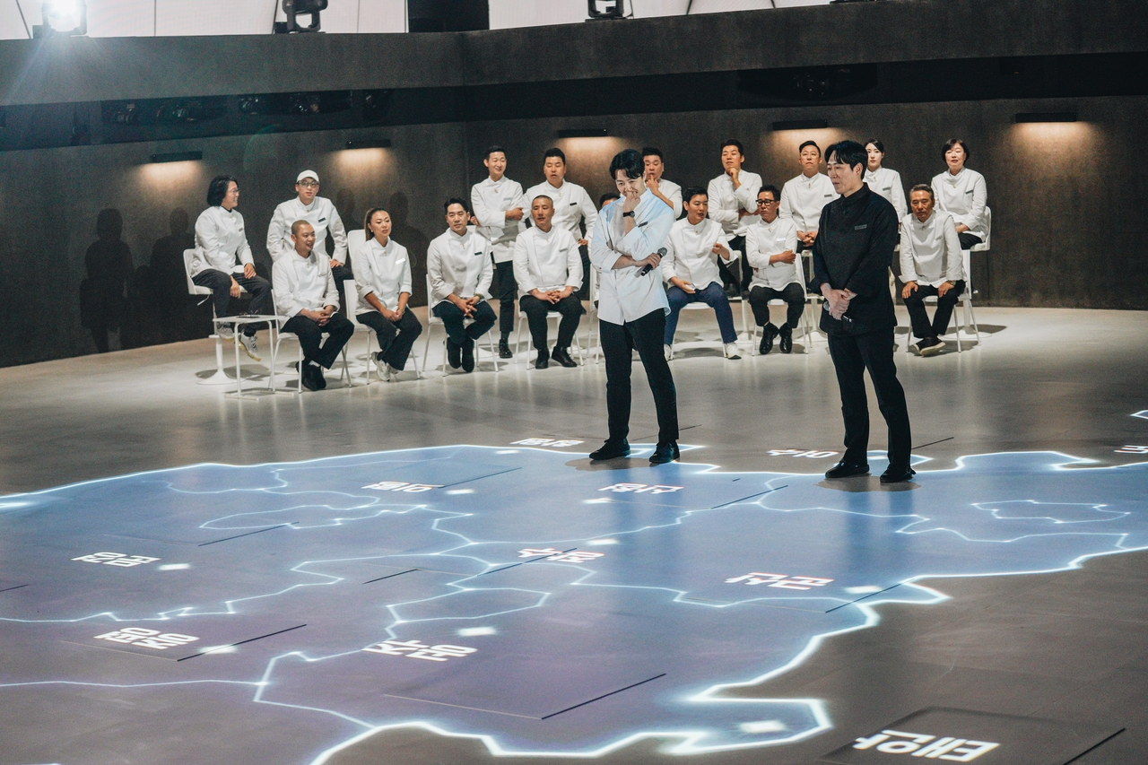 Contestants gather on the set of Netflix’s "Culinary Class Wars" Season 2, the hit competition show fueling Korea’s latest restaurant reservation frenzy. Within days of airing, the featured chefs saw bookings triple and waitlists stretch into hours. (Netflix)
