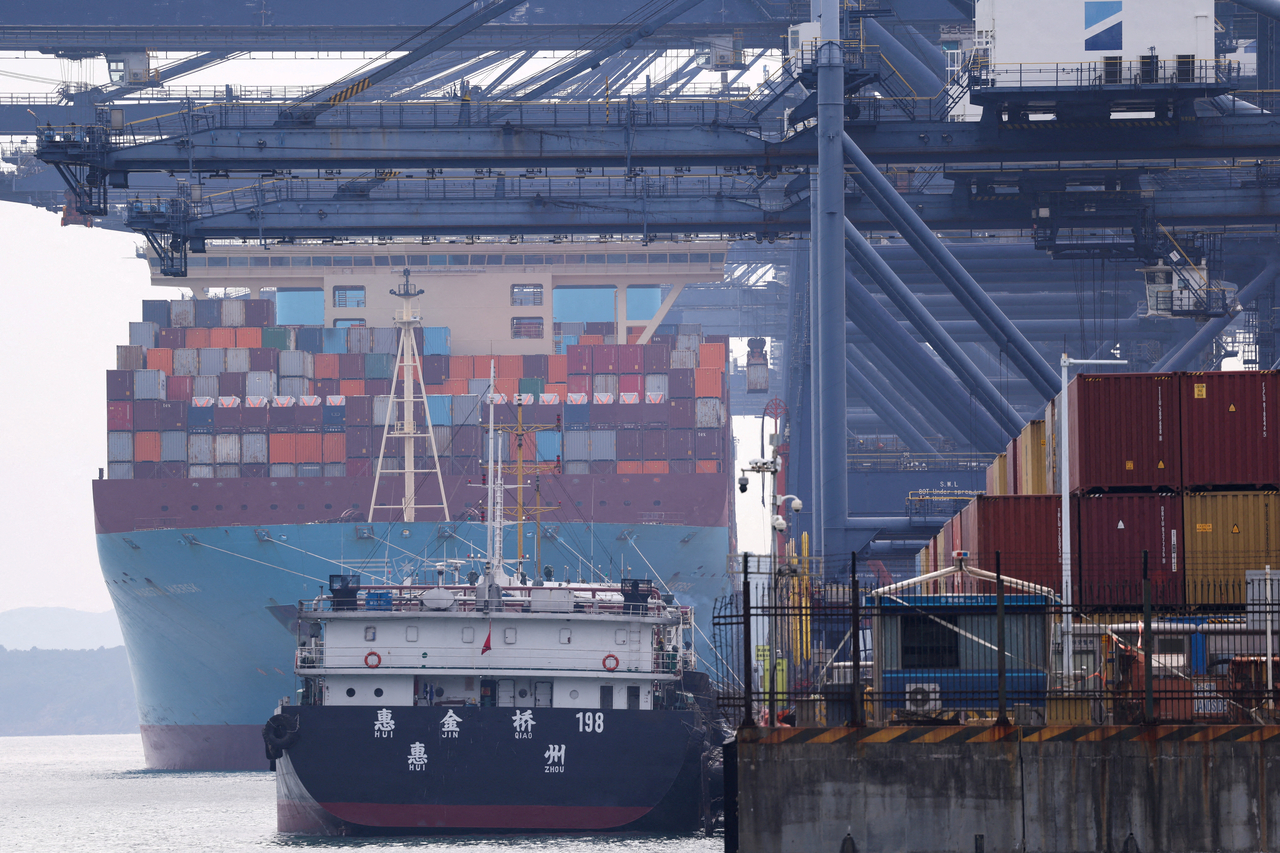 A cargo ship with containers docks at a terminal of the Yantian port in Shenzhen, Guangdong province, China, Oct. 30.   Reuters-Yonhap