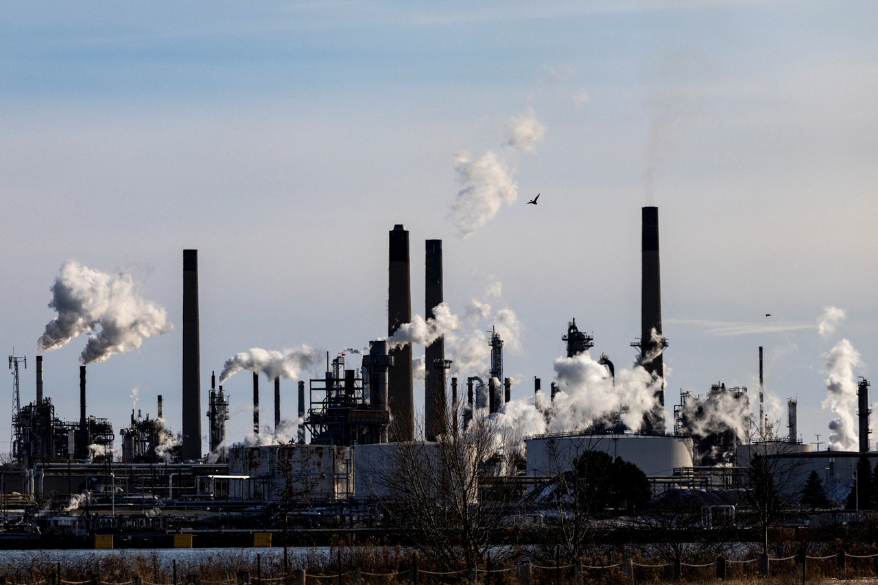 Petrochemical plants and refineries across the St. Clair River in Sarnia, Ontario, are seen from Port Huron, Michigan, Dec. 8.   Reuters-Yonhap