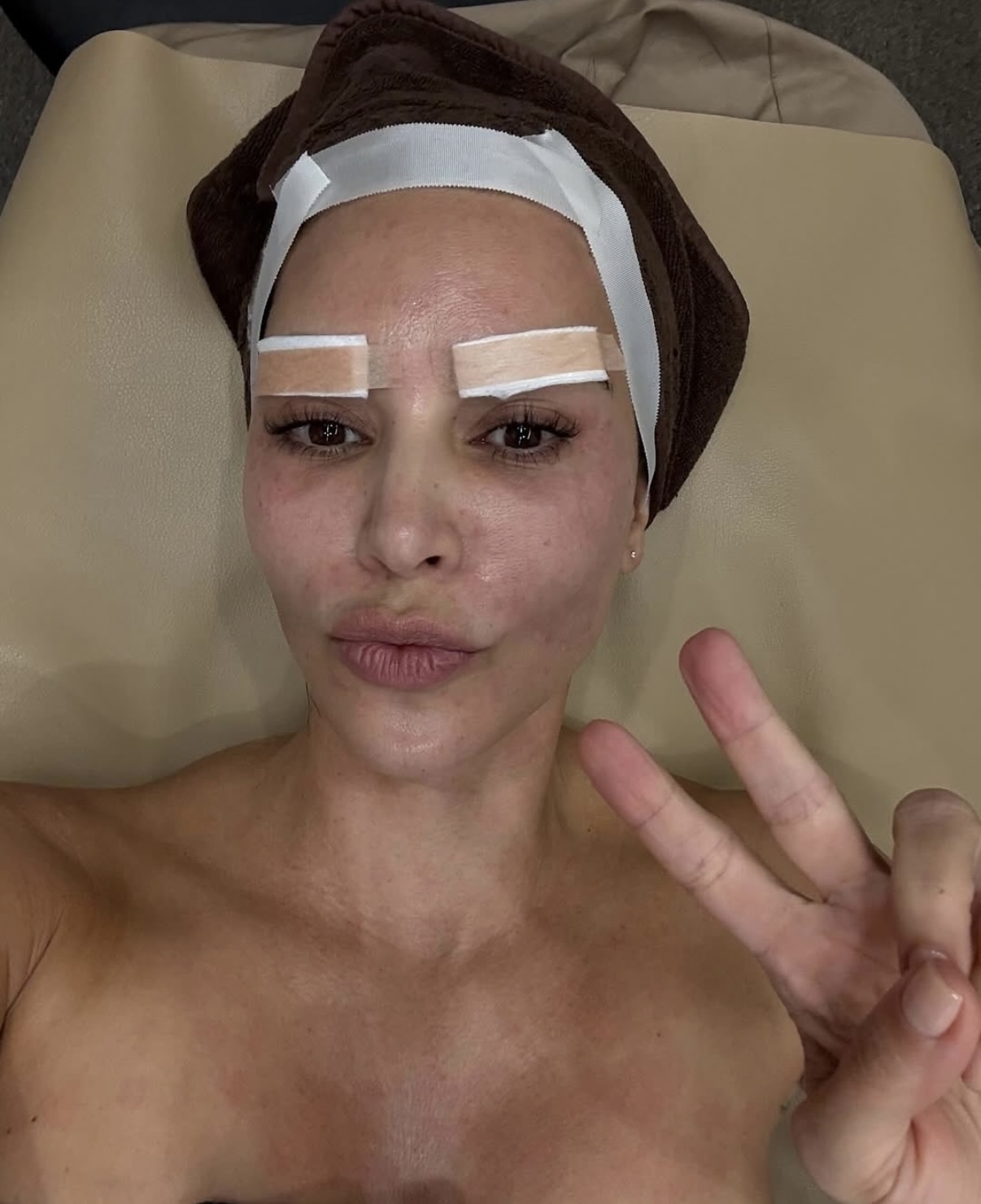 Kim Kardashian poses at a dermatologist clinic in Korea, where she received stem cell and skin booster treatments. (@kimkardashian, Instagram)