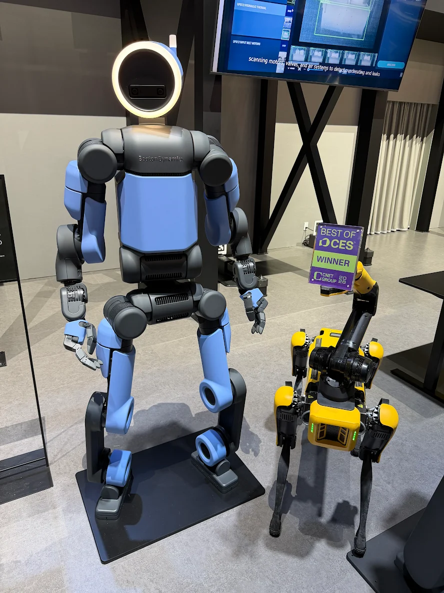 Boston Dynamics’ electric Atlas humanoid (left) and four-legged robot Spot won the best robot awards at CES 2026. (Hyundai Motor Group)