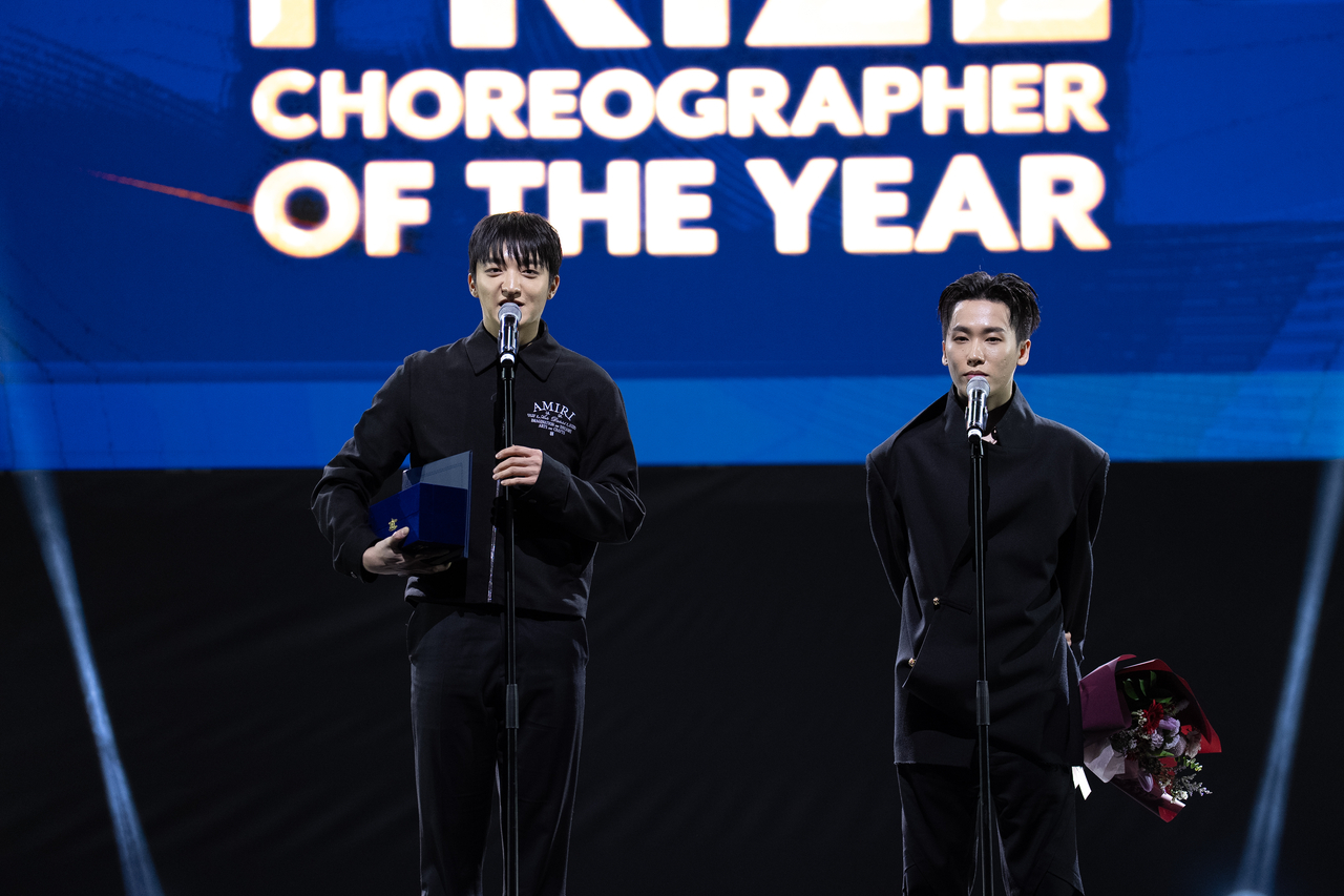 Vata (left) and Ingyoo (right), leader and deputy leader of choreography team We Dem Boyz, receive 2025 grand prize choreographer of the year at the Choreo Awards on Saturday. (KCCA)