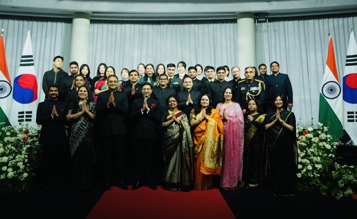 Indian Embassy officials and their family members pose for a group photo during India's 77th Republic Day celebrations at Sebitseom in Seocho-gu, Seoul, on Monday. (Indian Embassy in Seoul)