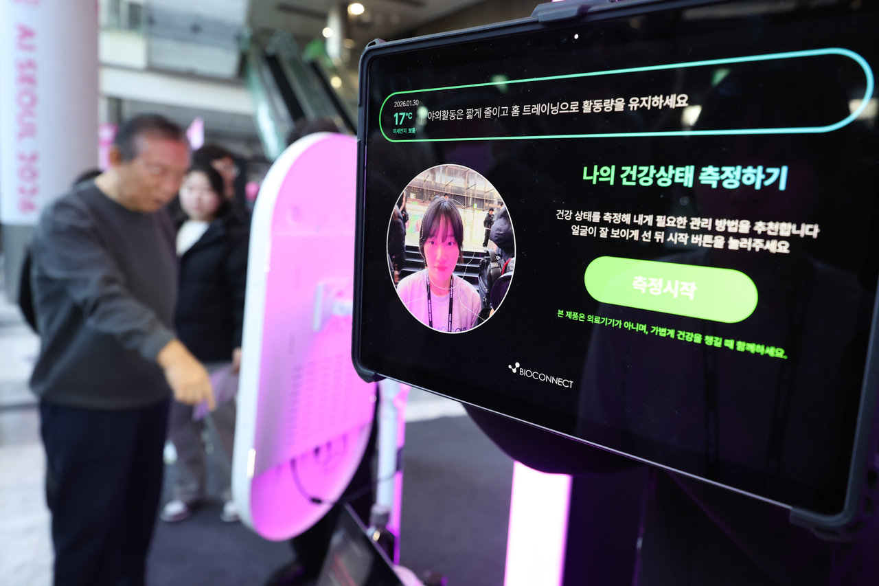 Attendees experience an AI-based digital healthcare booth at the “AI Seoul 2026” conference held at Coex in Gangnam, Seoul, Friday. (Yonhap)