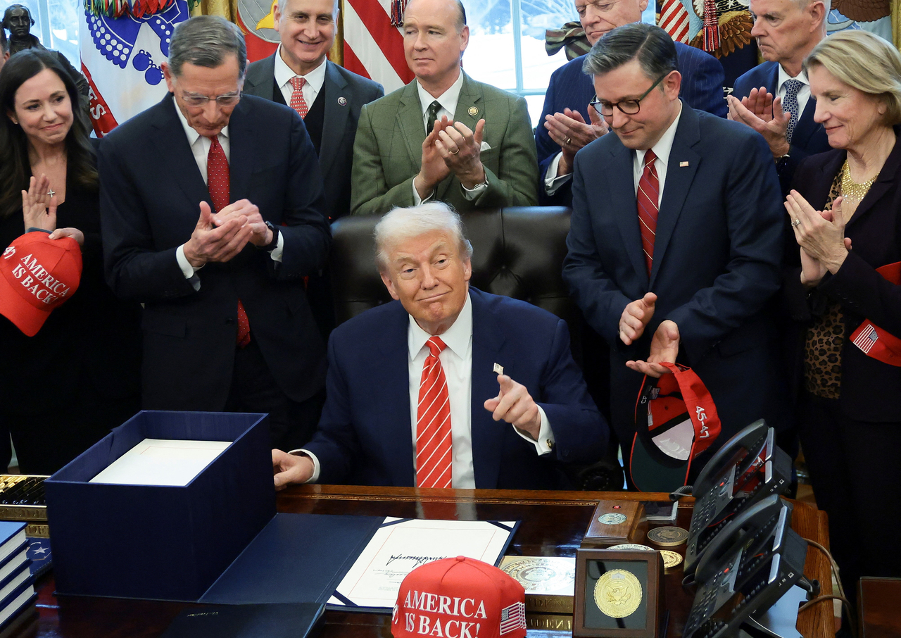 US President Donald Trump points after signing a bill to end the partial government shutdown at the White House in Washington on Tuesday.   Reuteres-Yonhap