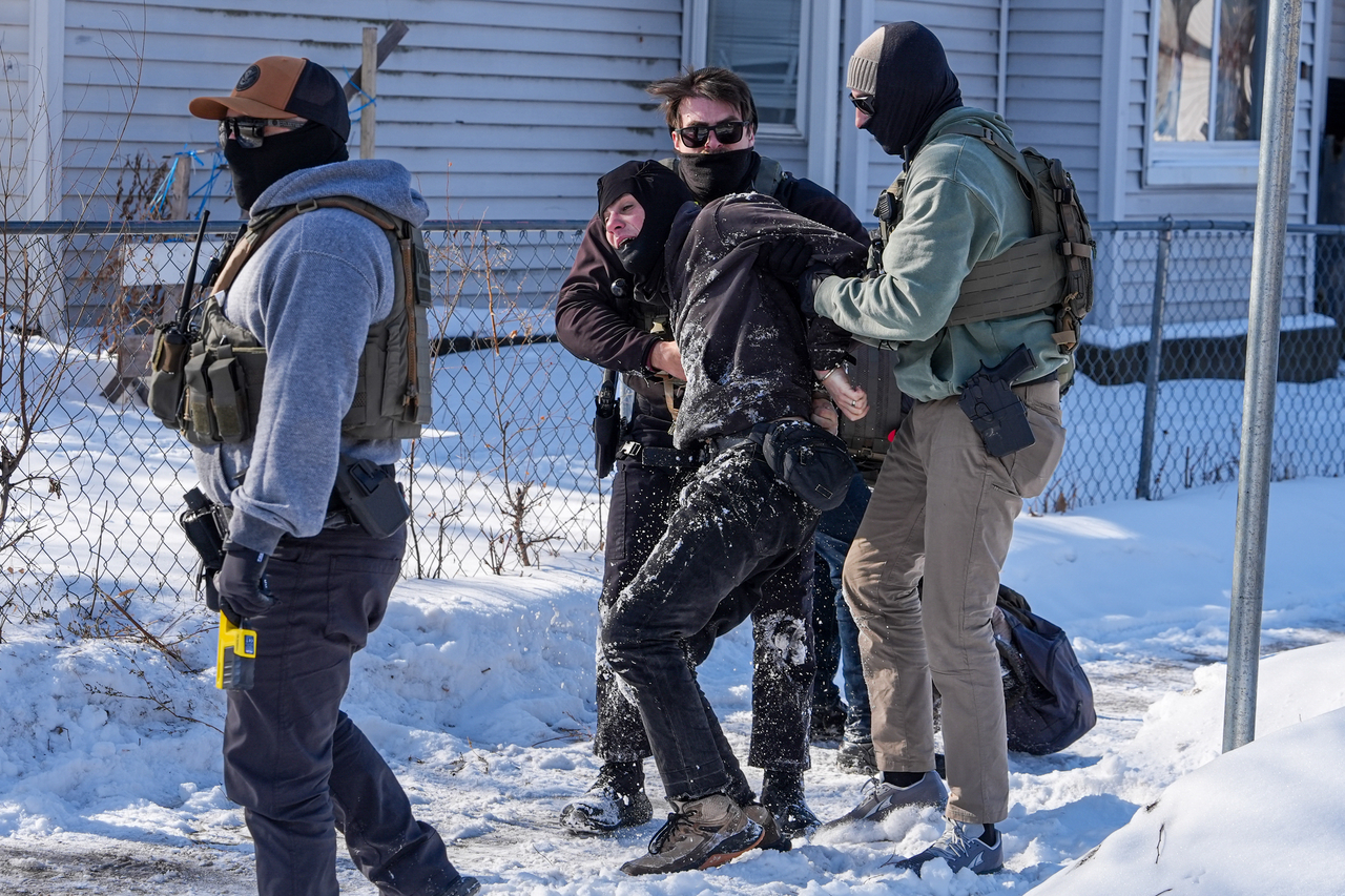 A person is detained (center) by federal agents, in Minneapolis. Tuesday.   (AP-Yonhap)