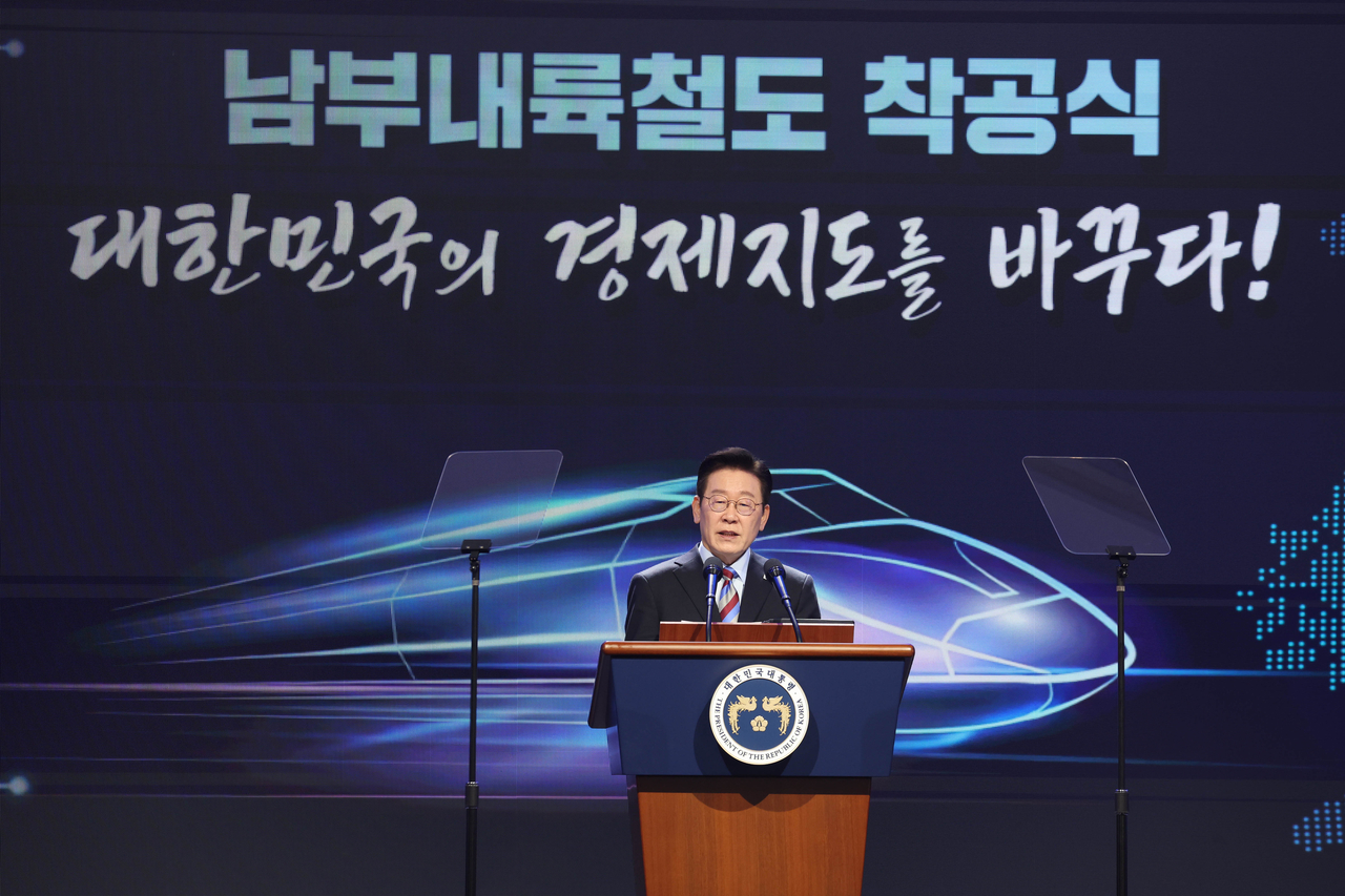 President Lee Jae Myung speaks during a ceremony in Geoje, South Gyeongsang Province, on Friday, to mark the start of building the Southern Inland Railway linking the city to Gimcheon in North Gyeongsang Province. (Yonhap)