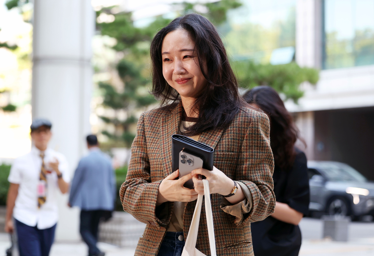 Former Ador CEO Min Hee-jin arrives at the Seoul Central District Court in Seoul on Sept. 11. (Newsis)