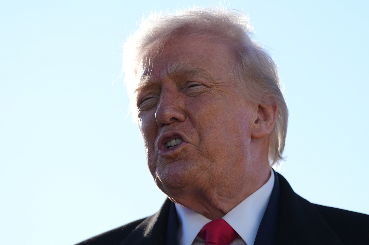 President Donald Trump speaks to reporters before boarding Air Force One at Pope Army Airfield, in Fort Bragg, North Carolina, Friday. (AP-Yonhap))