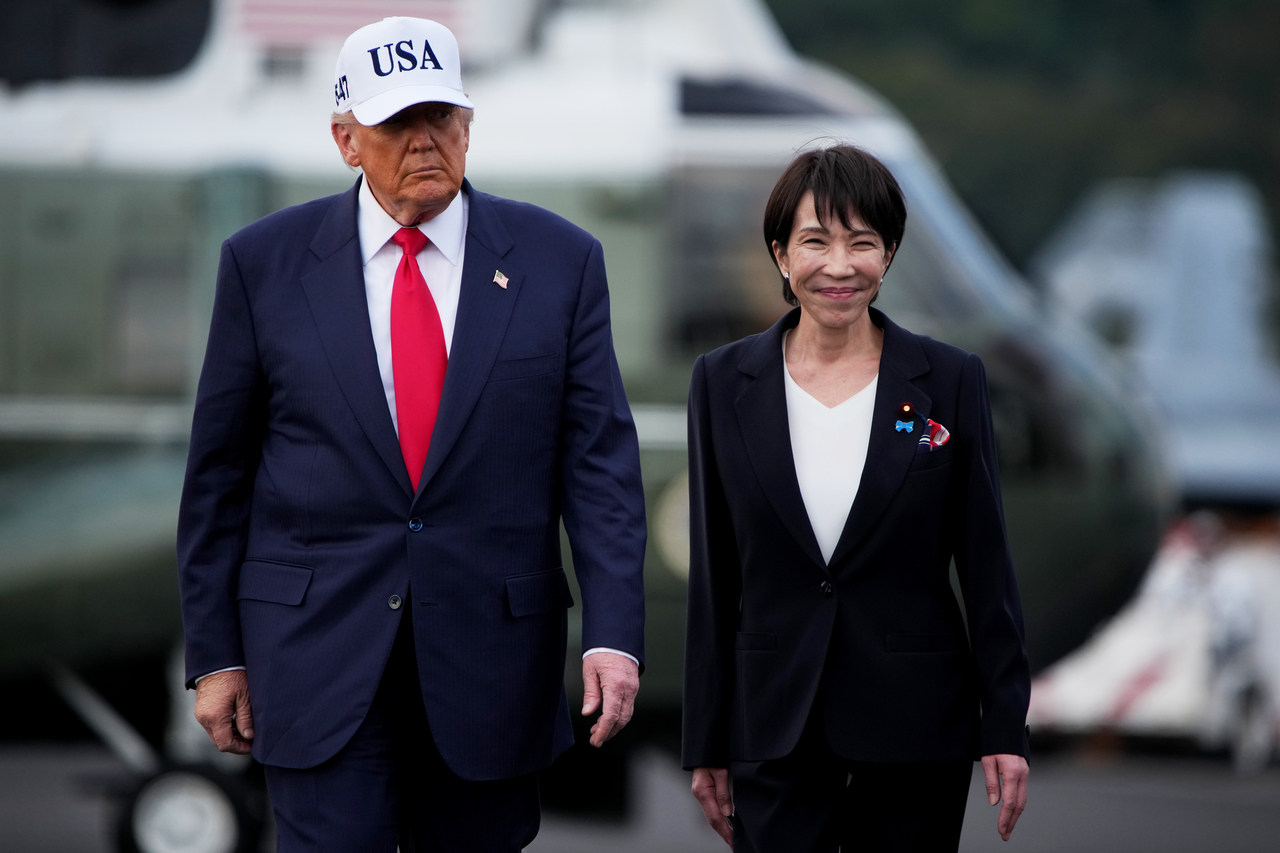 US President Donald Trump (left) and Japanese Prime Minister Sanae Takaichi arrive to speak to troops aboard USS George Washington at Fleet Activities Yokosuka on October 28, 2025 in Yokosuka, Japan. (Getty Images)