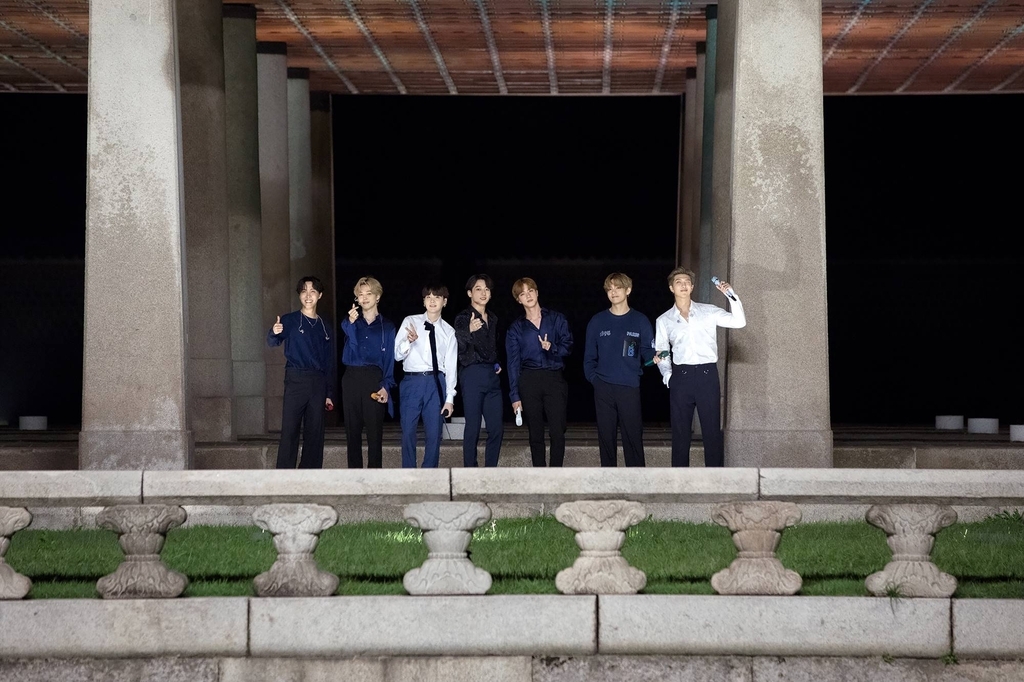 BTS poses at Gyeonghoeru Pavilion in Gyeongbokgung ahead of a performance of 