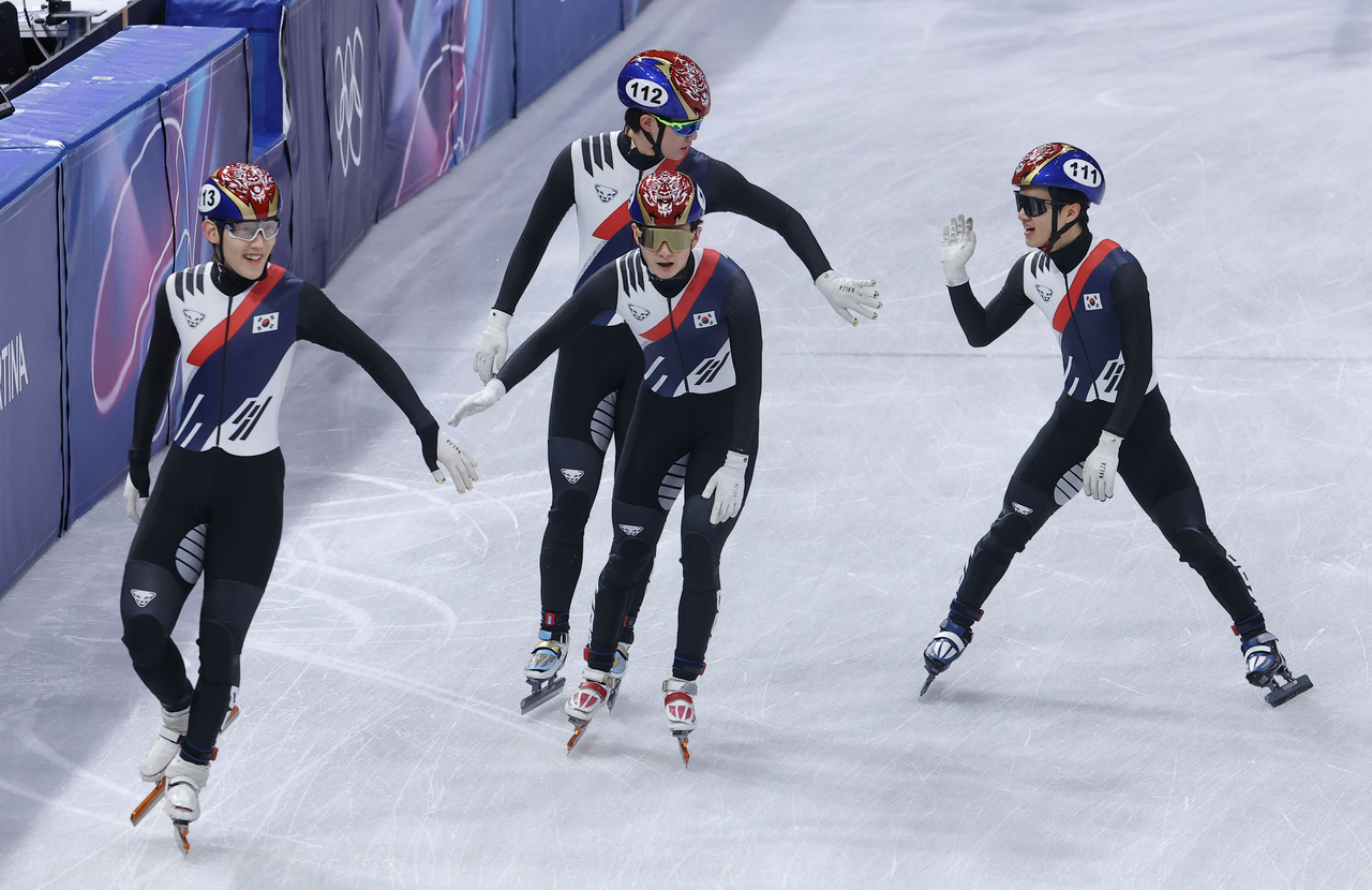 Lim Jong-eon, Shin Dong-min, Lee Jeong-min and Lee June-seo celebrate after advancing to the final in the men’s 5,000-meter short track relay semifinal of  the Milan Cortina Olympics, at the ice skating arena in Milan, Italy, on Monday. (Yonhap)