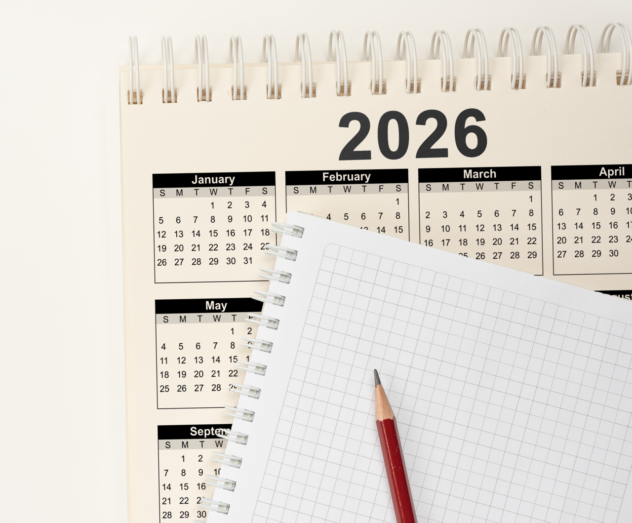 Blank notepad and 2026 calendar on white background. (123RF)