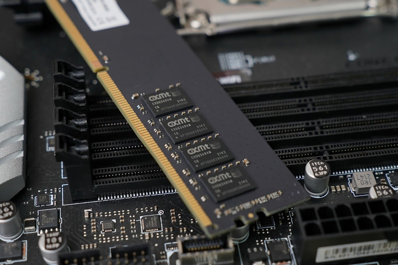 A CXMT DRAM memory module is shown installed on a computer motherboard. CXMT, or ChangXin Memory Technologies, is a Chinese memory chipmaker focused on DRAM production. (CXMT)
