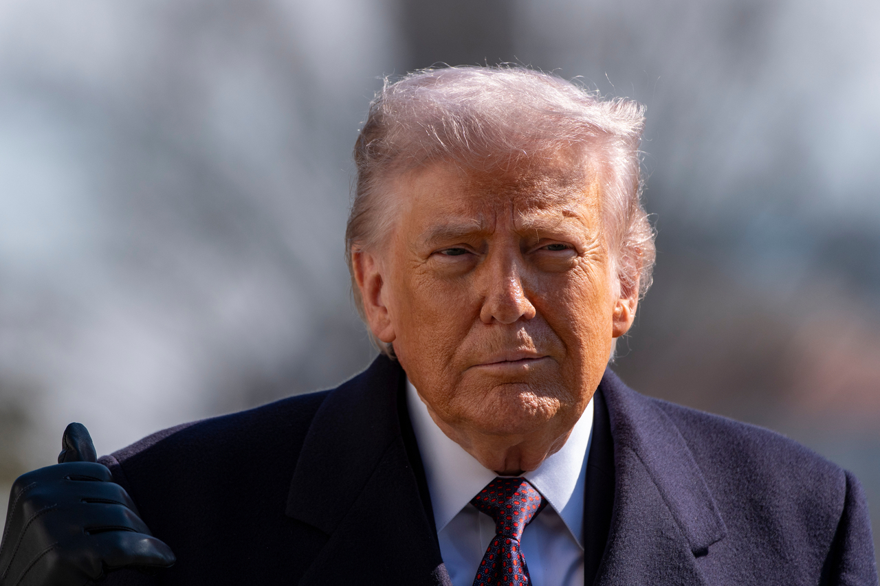 US President Donald Trump walks to speak with reporters before departing on Marine One from the South Lawn of the White House in Washington on Friday. (AP-Yonhap)