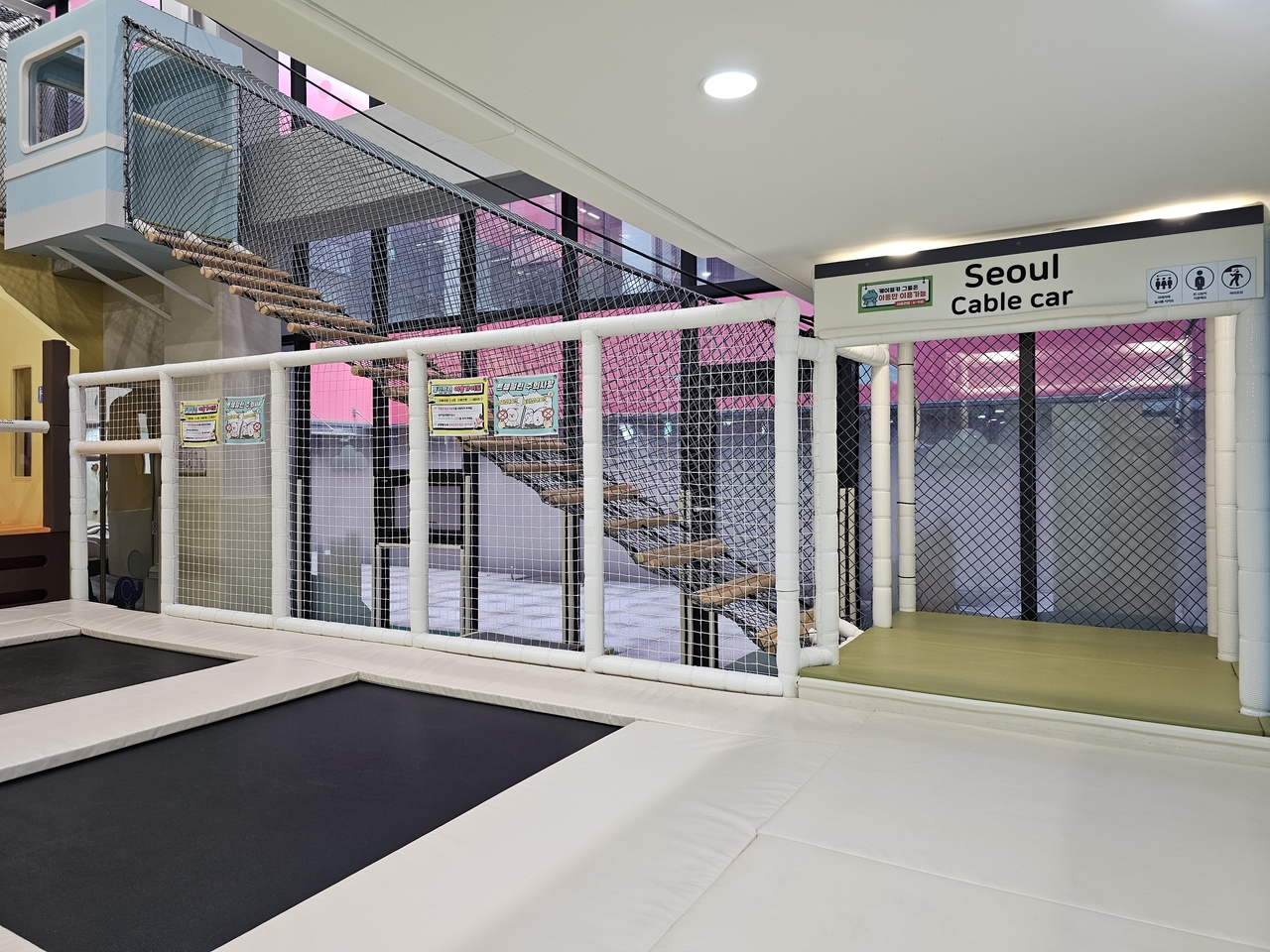 A staircase structure modeled after the Namsan cable car stands beside large trampolines at the city-run Seoul Kids Cafe in Daebang-dong, Dongjak-gu, Dec. 17. (Courtesy of Choi Jae-hee)