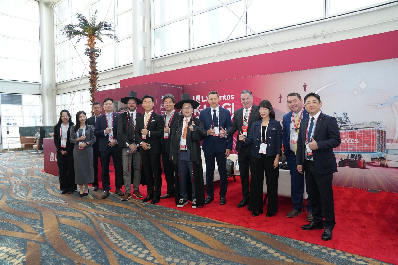 LX Pantos officials pose for a photo at the company's exhibition booth at the Trans-Pacific Maritime Conference 2026 held March 1-4 in Long Beach, California. (LX Pantos)