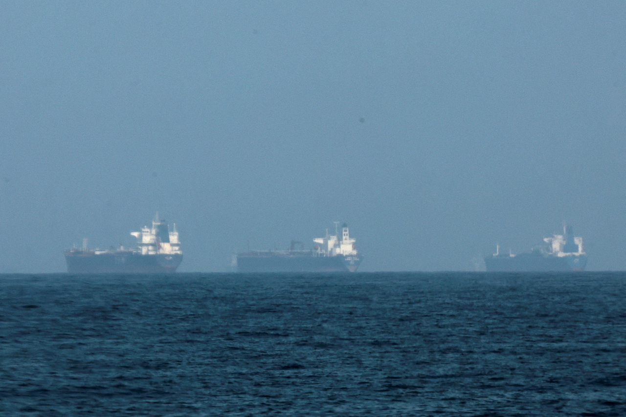 Tankers are seen off the coast of the Fujairah, as Iran vows to close the Strait of Hormuz, amid the US-Israel conflict with Iran, in Fujairah, United Arab Emirates, Tuesday.   Reuters-Yonhap
