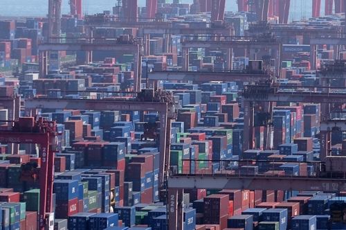 Containers are stacked at a port in South Korea's southeastern city of Busan, in this file photo from Feb. 22, 2026. (Yonhap)