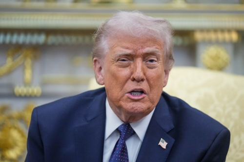 US President Donald Trump speaks during a meeting with German Chancellor Friedrich Merz in the Oval Office at the White House in Washington on Tuesday, 2026, in this photo released by the Associated Press. (Yonhap)