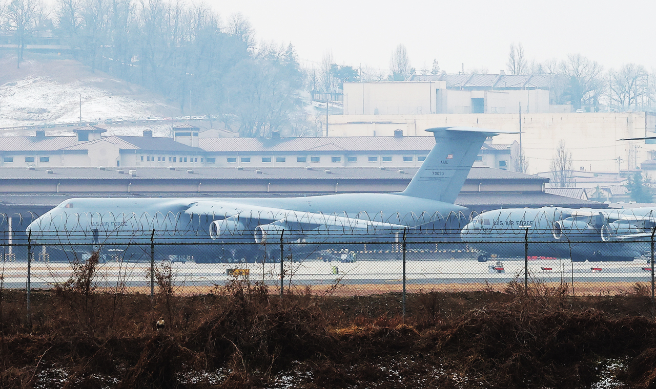 US Air Force heavy transport aircraft, including C-5 and C-17 cargo planes, are seen parked at Osan Air Base in Pyeongtaek, Gyeonggi Province, on Friday. (Yonhap)
