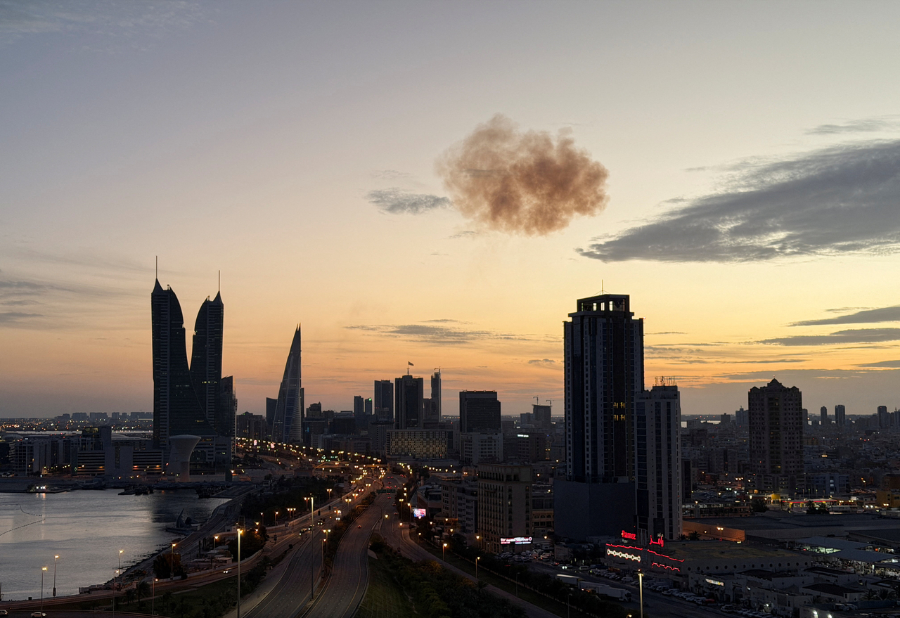 Smoke rises after an Iranian drone was intercepted over the Bahrain Financial Harbor towers, which houses the Israeli embassy, in Manama, Bahrain, Friday.   Reuters-Yonhap