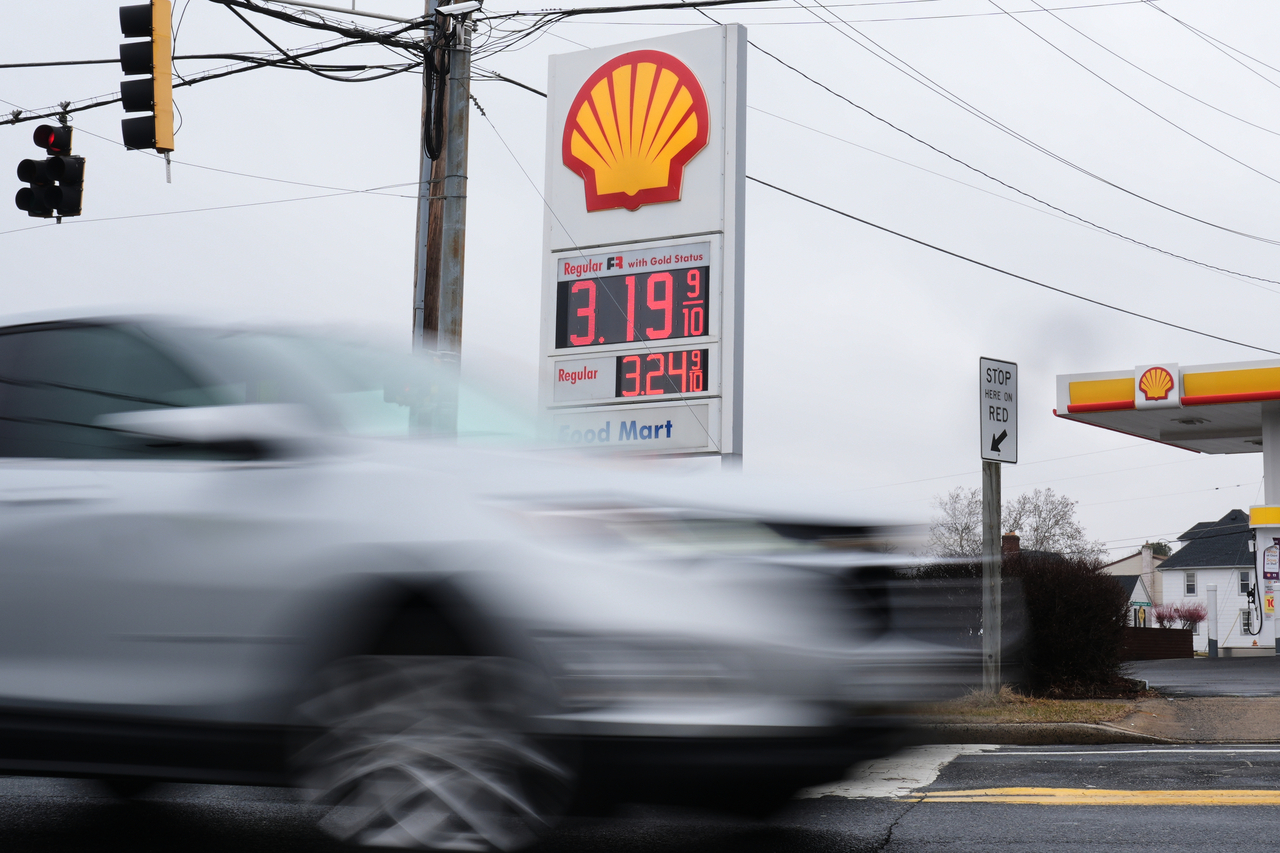 Fuel prices are displayed at a gas station as cars drive by in Baltimore on Wednesday.   AP-Yonhap